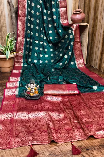 Dark green satin silk blend saree with contrast zari woven borders