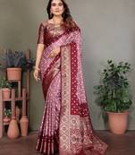 Peach handmade bandhej satin silk saree with zari weaving border