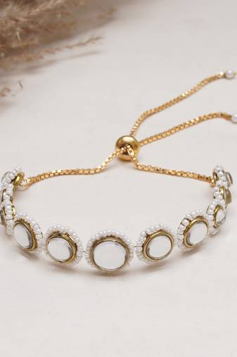 Golden circular kundan with white pearls adjustable bracelet