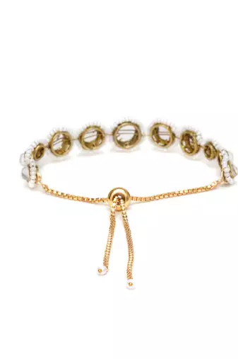 Golden circular kundan with white pearls adjustable bracelet