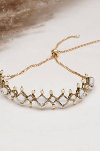 Golden kite shaped kundan with white pearls adjustable bracelet