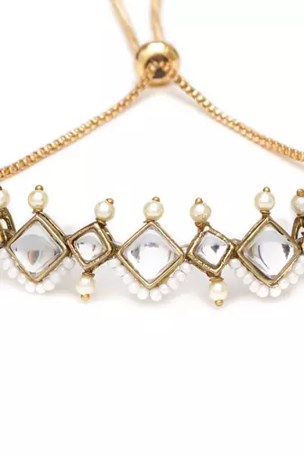 Golden kite shaped kundan with white pearls adjustable bracelet