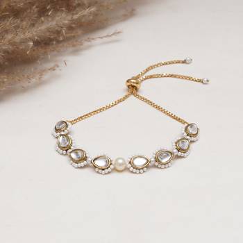 Golden tilak kundan with white pearls adjustable bracelet 1