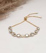 Golden tilak kundan with white pearls adjustable bracelet