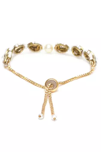 Golden tilak kundan with white pearls adjustable bracelet