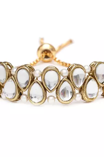Golden double layer tilak kundan with white pearls adjustable bracelet