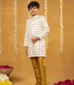 Embroidered off-white sherwani and mustard coloured pant