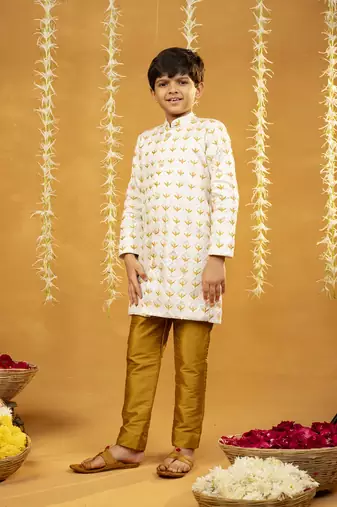 Embroidered off-white sherwani and mustard coloured pant