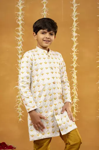 Embroidered off-white sherwani and mustard coloured pant