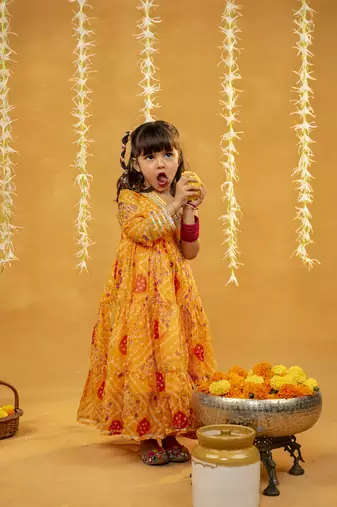 Yellow bandhni printed gathered one shoulder full sleeve dress