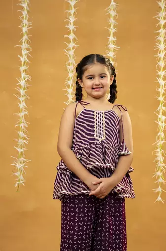 Purple bandhni and leheriya printed tie-up straps peplum top and flared palazzo