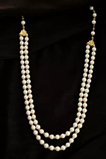 Double-strand pearl necklace with gold-toned clasps