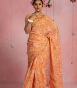 Orange cotton blend stripegeometric print lace border saree with unstitched blouse piece