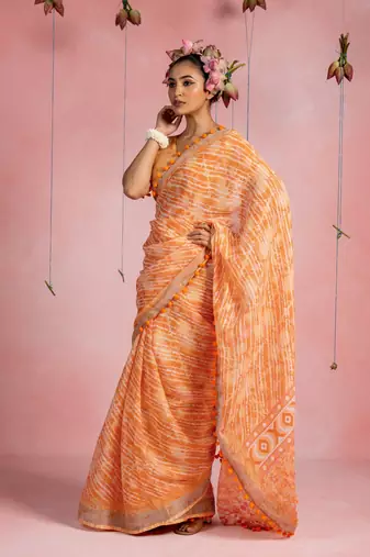 Orange cotton blend stripegeometric print lace border saree with unstitched blouse piece
