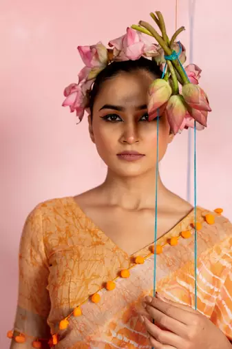 Orange cotton blend stripegeometric print lace border saree with unstitched blouse piece