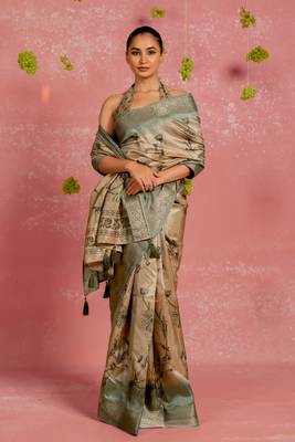 Beige silk blend floral print golden zari woven border tassels saree with unstitched blouse piece 1