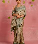 Beige silk blend floral print golden zari woven border tassels saree with unstitched blouse piece