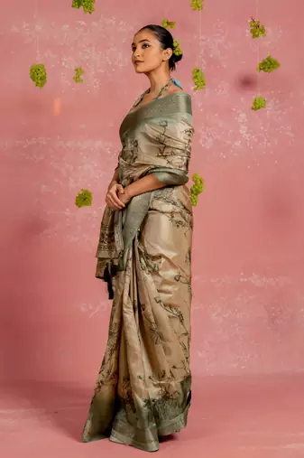Beige silk blend floral print golden zari woven border tassels saree with unstitched blouse piece