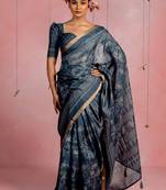 Dark dusty blue art silk floral print golden zari woven border saree with unstitched blouse piece