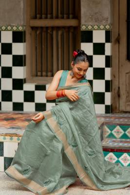 Sea green organza embroidered golden zari woven border saree with unstitched blouse piece 2