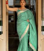 Sea green silk blend polka dots stripes print golden zari border saree with unstitched blouse piece