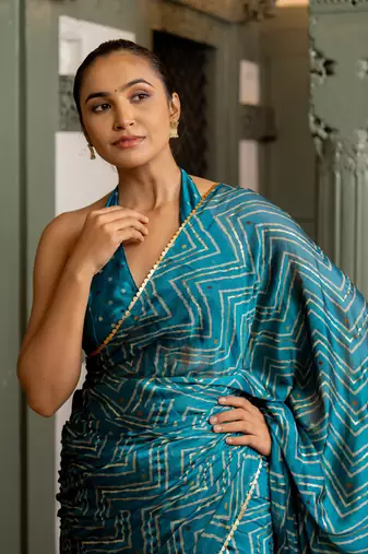 Rama blue chiffon foil chevron print ethnic motif sequins lace border saree with unstiched blouse piece