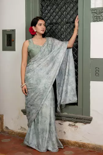 Light dusty blue chiffon foil floral print lace border saree with unstiched blouse piece