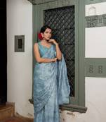 Light dusty blue chiffon foil floral print lace border saree with unstiched blouse piece
