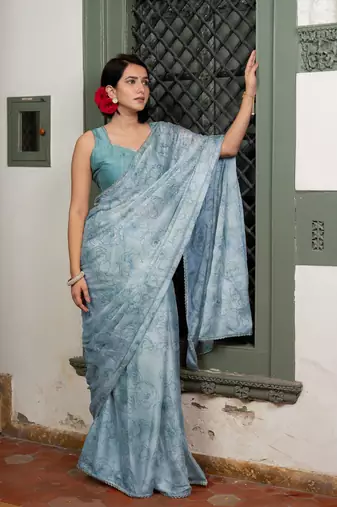Light dusty blue chiffon foil floral print lace border saree with unstiched blouse piece