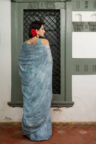Light dusty blue chiffon foil floral print lace border saree with unstiched blouse piece
