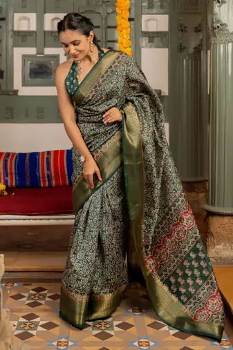Dark green art silk ajrakh print golden zari saree with unstiched blouse piece