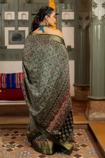 Dark green art silk ajrakh print golden zari saree with unstiched blouse piece