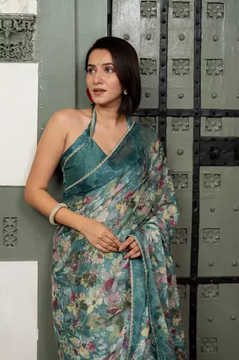 Dark turquoise blue chiffon floral print lace border saree with unstiched blouse piece