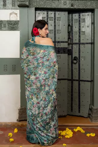 Dark turquoise blue chiffon floral print lace border saree with unstiched blouse piece