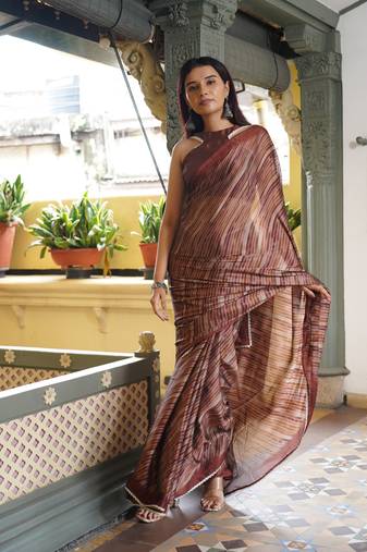 Dark rust chiffon stripes leheriya print lace border saree with unstiched blouse piece