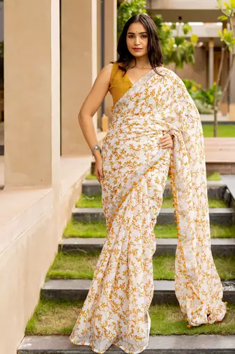 White cotton blend leaf print pom pom lace border saree with unstiched blouse piece