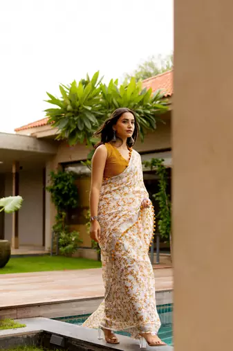 White cotton blend leaf print pom pom lace border saree with unstiched blouse piece