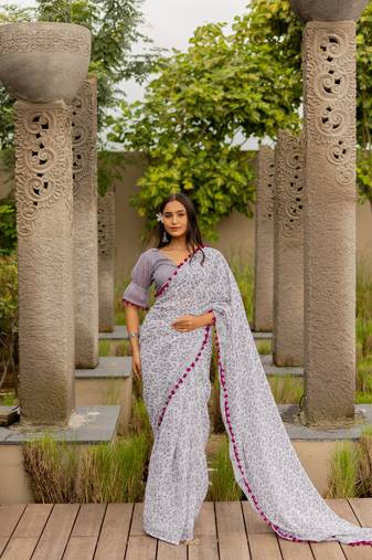 White cotton blend leaf print pom pom lace border saree with unstiched blouse piece