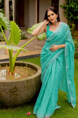 Light teal green cotton blend floral print crochet lace border saree with unstiched blouse piece 1