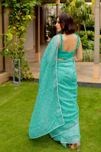 Light teal green cotton blend floral print crochet lace border saree with unstiched blouse piece