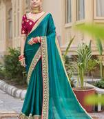 Aqua green georgette embroidered wedding wear saree
