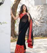 Red and black thread work saree