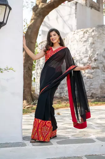 red and black thread work saree