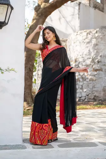 red and black thread work saree