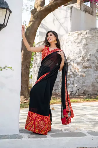 red and black thread work saree