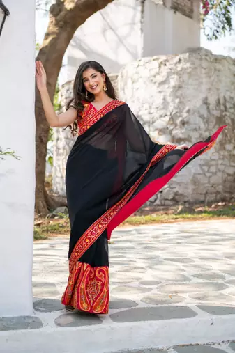 red and black thread work saree