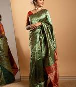 Green and red zari woven saree with floral motifs