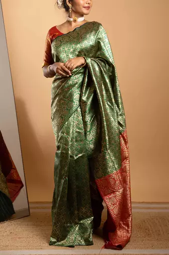 Green and red zari woven saree with floral motifs