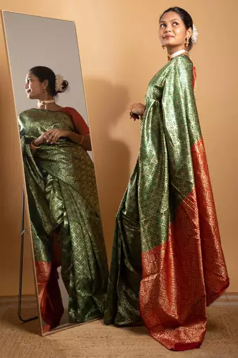 Green and red zari woven saree with floral motifs