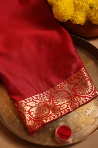 Green and red zari woven saree with floral motifs